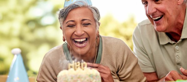Lady laughing blowing out candles (1) Lady laughing blowing out candles (1)