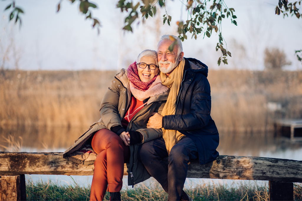 older couple sitting on bench