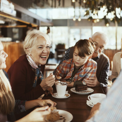 Close up of a happy family enjoying time together in a cafe